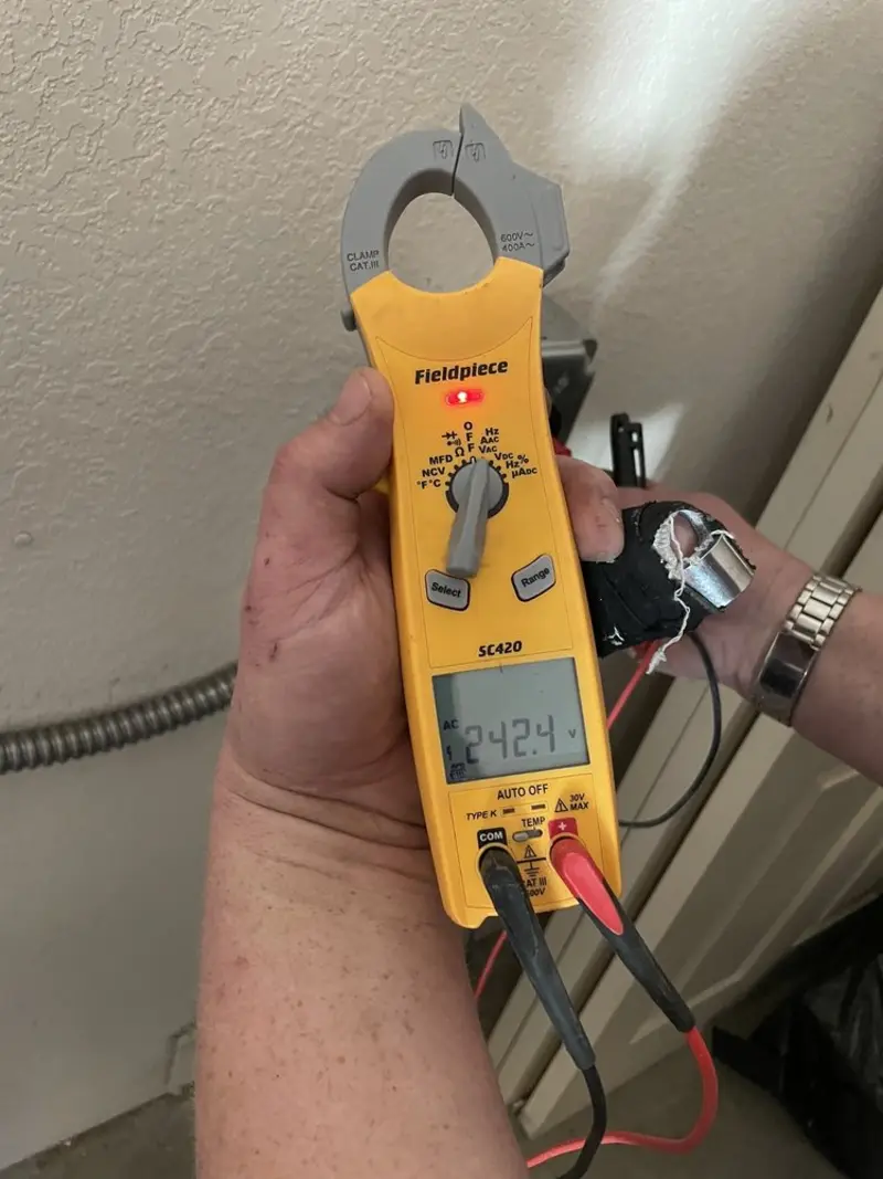Voltage testing with clamp meter during Outlet Installation in Orangeburg